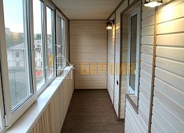 Остекление и отделка балкона имитацией бруса с утеплением. 